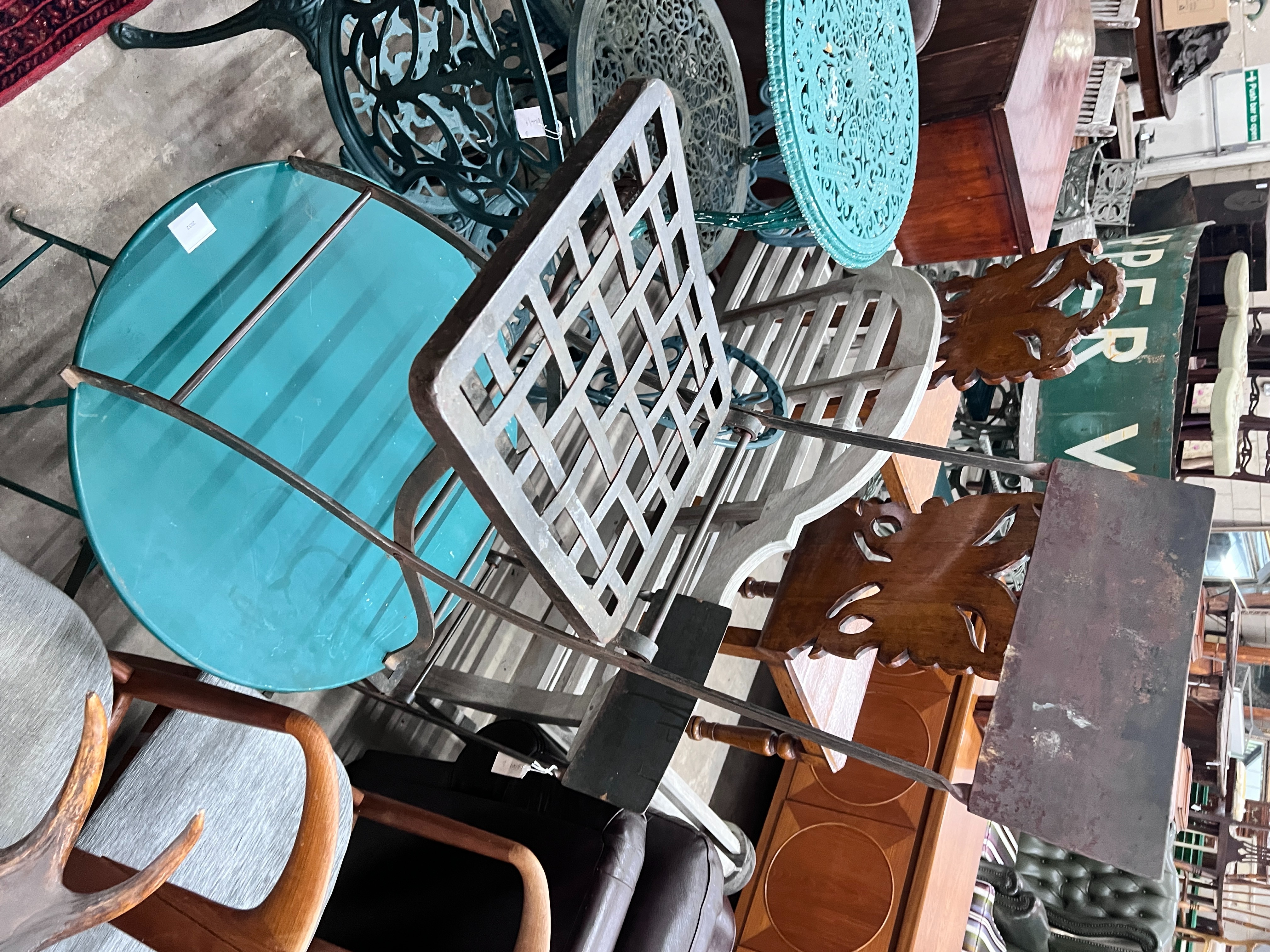 A painted metal circular folding garden table, diameter 59cm, height 70cm and two chairs